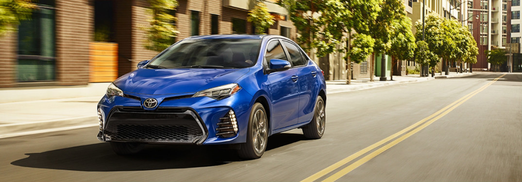 2018 Toyota Corolla in a bold blue driving down city streets