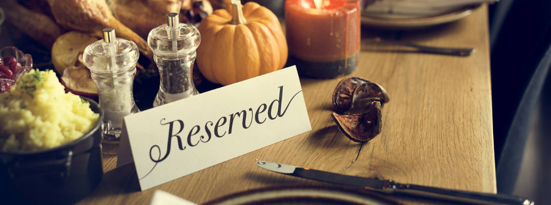 Thanksgiving dinner table with "reserved" note