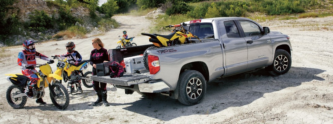 2020 Toyota Tundra exterior shot showing family and dirt bikes on sand