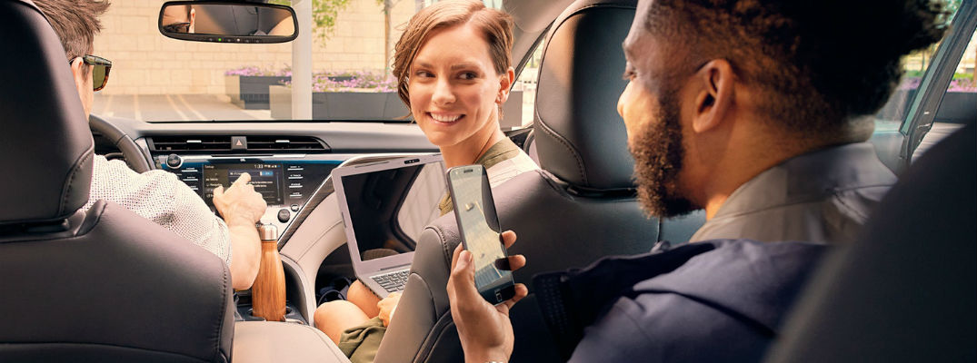 A photo of three vehicles using technology inside of a Toyota vehicle.