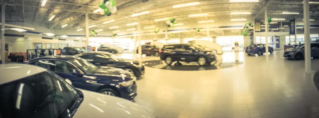 A photo illustration of the showroom of a car dealership's showroom.