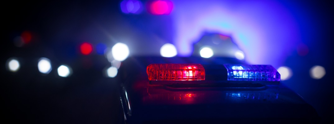 A stock photo of emergency lights at night.