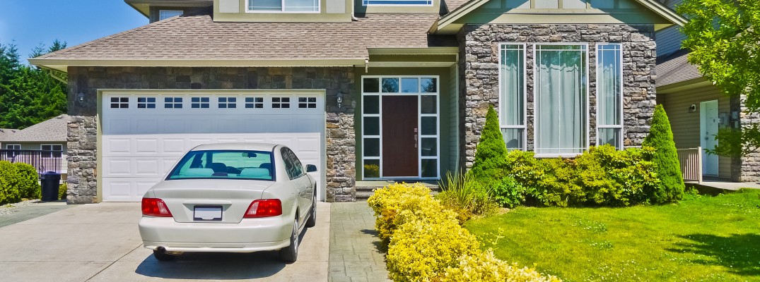 A stock photo of a vehicle parked in a driveway.