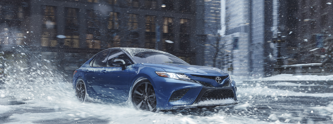 Blue 2020 Toyota Camry AWD in snow