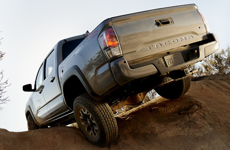 A photo of a 2020 Toyota Tacoma climbing a hill.