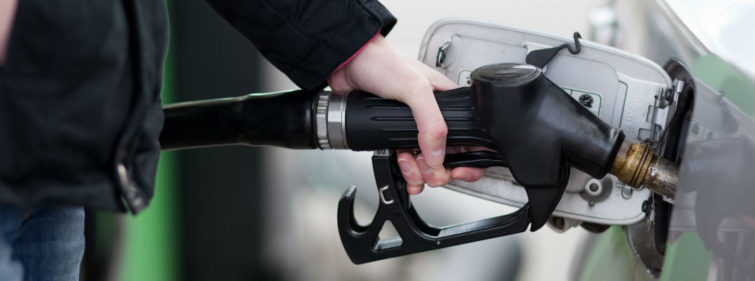 A stock photo of a person filling up their vehicle with gasoline.