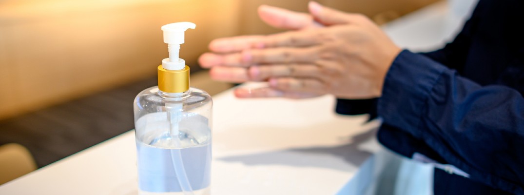 A stock photo of a person washing their hands with hand-sanitizer.