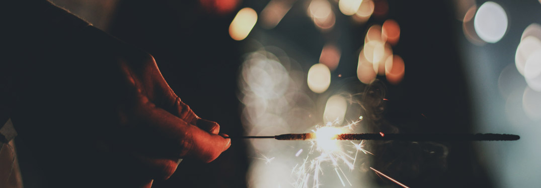 Person Holding Sparkler on NYE