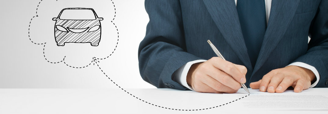 man writing on paper, thought bubble with car inside
