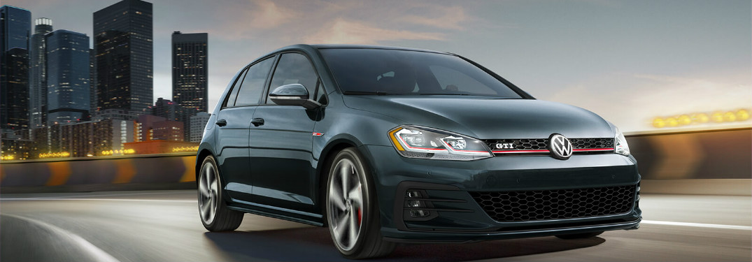 2018 Volkswagen Golf GTI driving down a city road