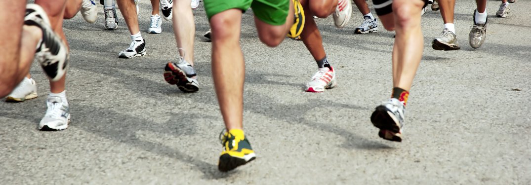 A close-up on the legs of a group of runners