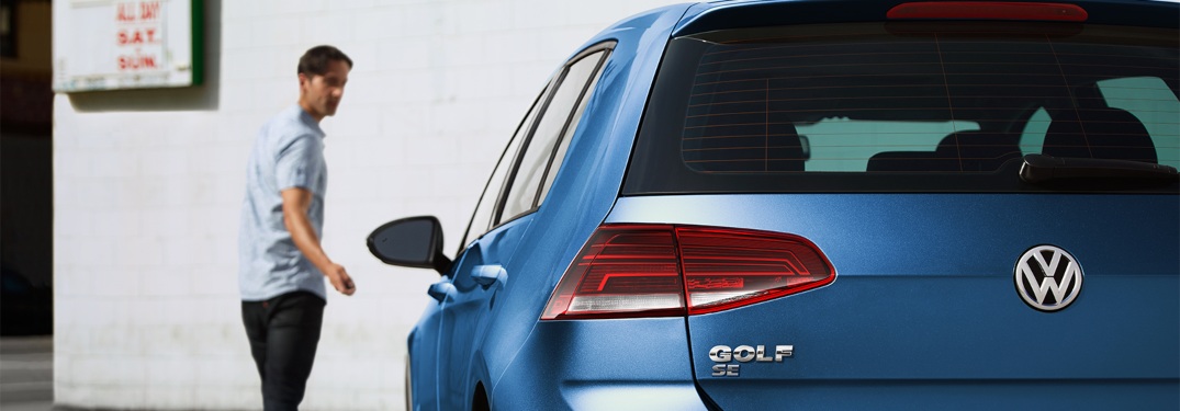 A man remotely locking a 2019 Volkswagen Golf