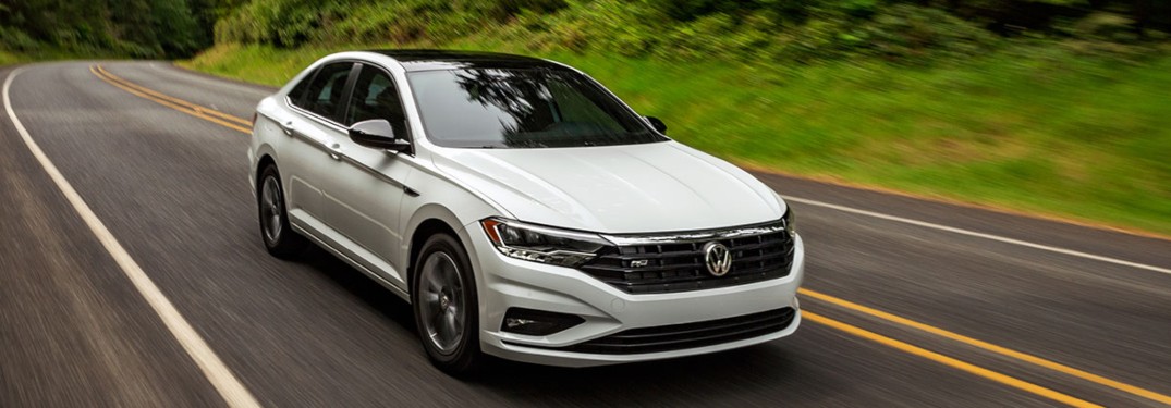 2020 Volkswagen Jetta driving down a rural road