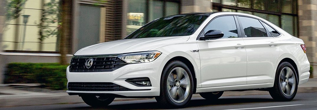 2020 Volkswagen Jetta driving down a city street
