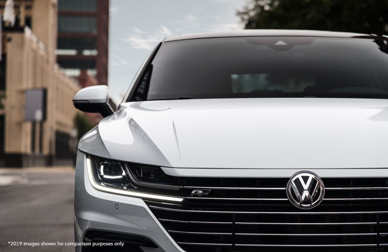 A front grille image of the 2020 Volkswagen Arteon parked on a city road.
