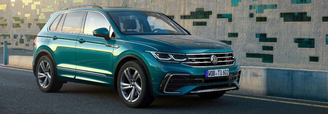 A front and side view of a teal 2022 Volkswagen Tiguan.
