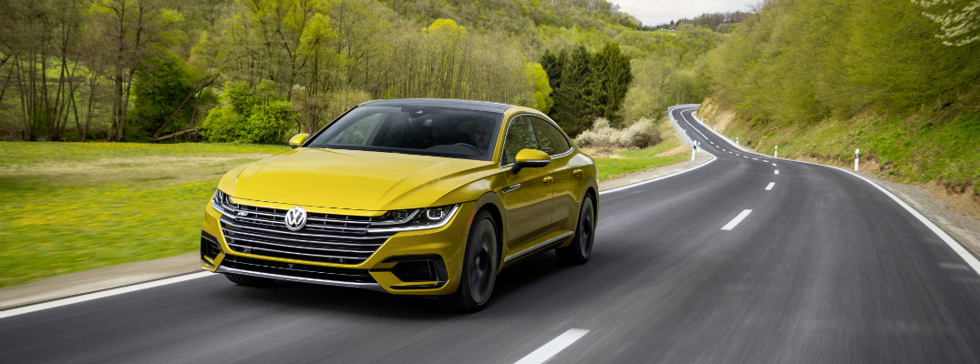 2019 Volkswagen Arteon R-Line Appearance Package driving down curving country forest road