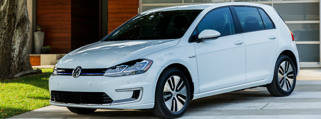 2018 Volkswagen e-Golf exterior shot parked on driveway in front of garage and under the shade of a tree