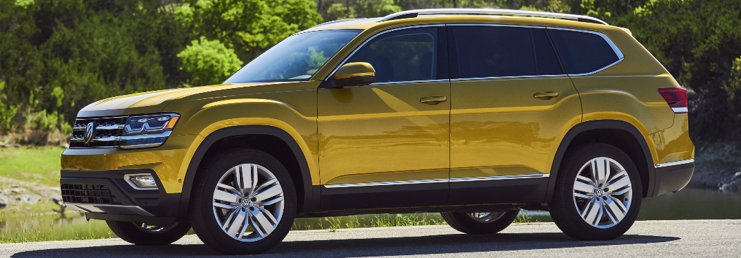 Yellow 2018 Volkswagen Atlas Parked next to a Forest