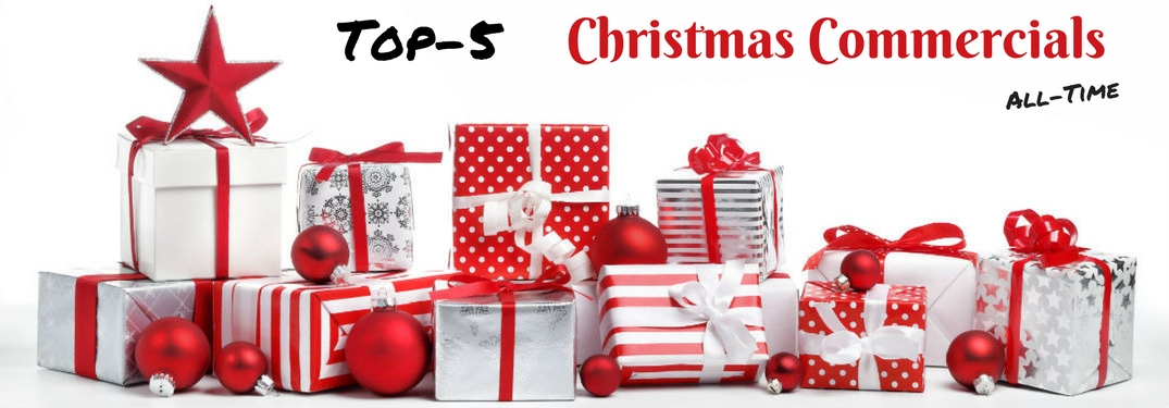 Top-5 Christmas Commercials All-Time, text on an image of stacks of wrapped presents