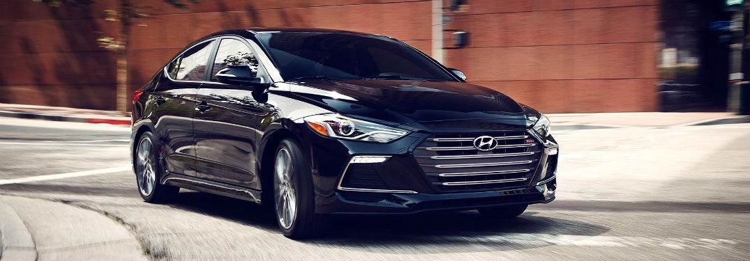 Passenger side exterior view of as blue 2018 Hyundai Elantra