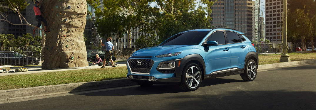 Driver side exterior view of a blue 2018 Hyundai Kona