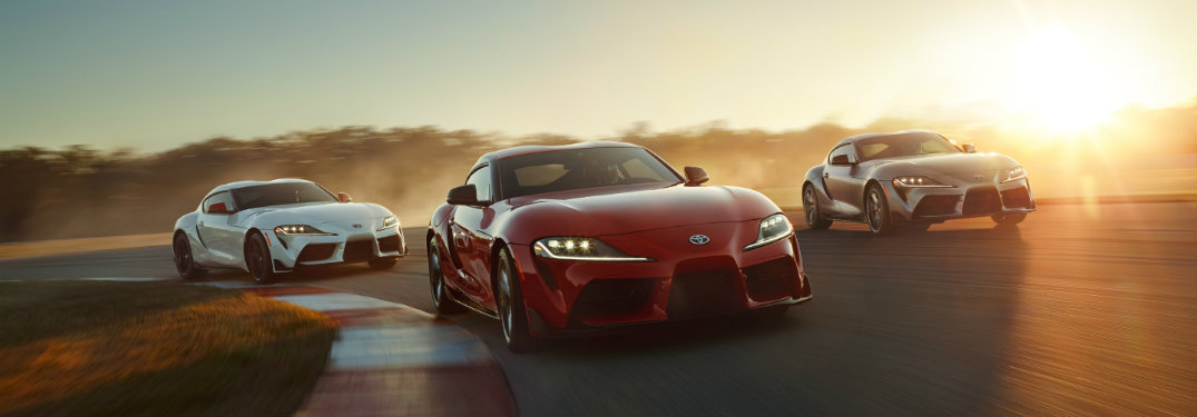 white-red-and-gray-2020-Toyota-Supra-models-on-racetrack