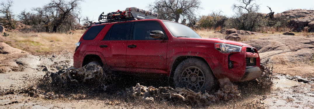 Red 2020 Toyota 4runner Venture Edition Driving Through Muddy Water O Toyota Vacaville