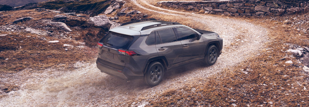 Dark grey 2020 Toyota RAV4 driving on a mountainous road