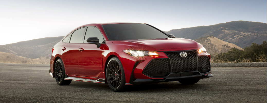 Red 2020 Toyota Avalon with mountains in the background
