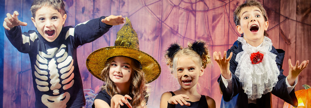 Kids in Halloween costumes