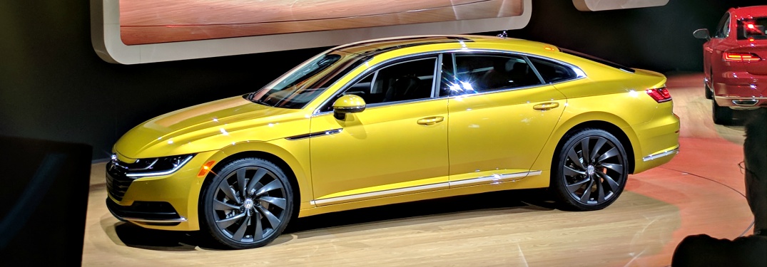 2019 VW Arteon yellow side view at the Chicago Auto Show