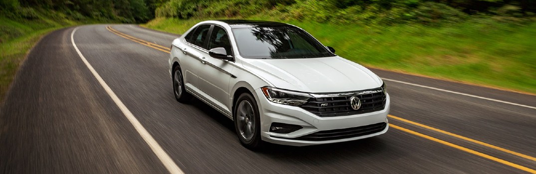 2020 Volkswagen Jetta driving down a road