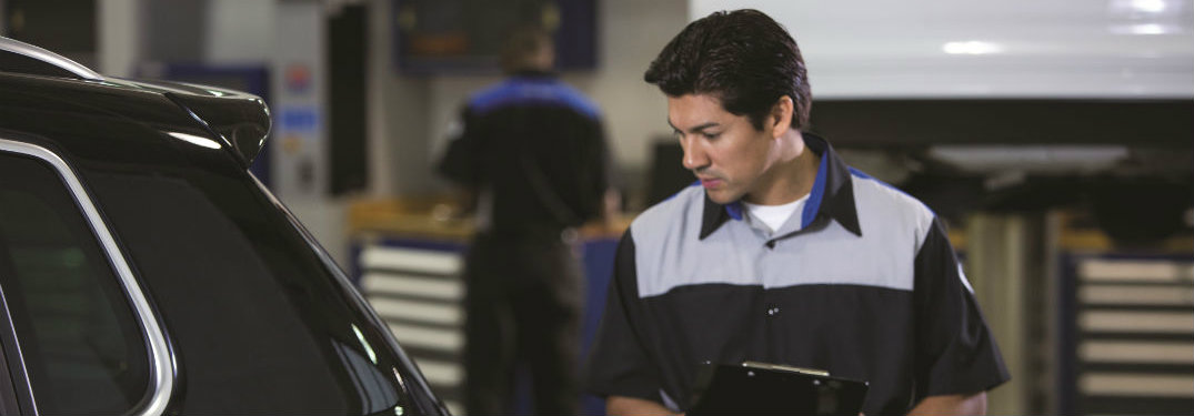 VW technician performing inspection