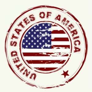 rubber stamp with an American flag in the middle surrounded by the words United States of America