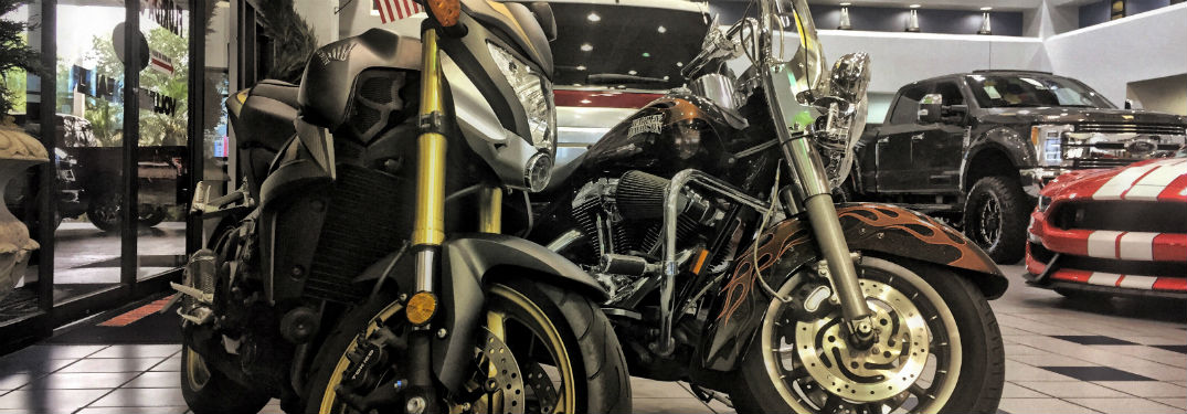 a pair of motorcycles in the Brandon Ford showroom