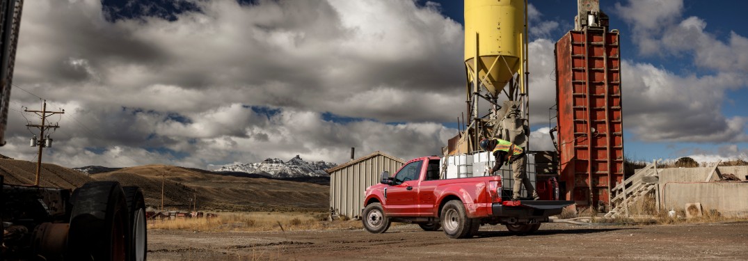 red 2020 Ford Super Duty parked at a job site