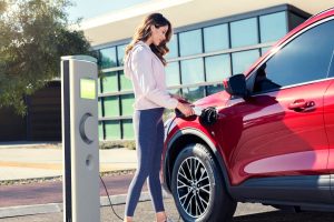 woman charging her 2020 Ford Escape Plug-In Hybrid
