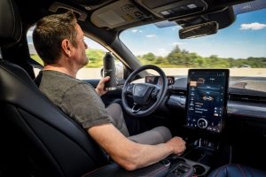 Driver Using Ford Active Drive Assist technology