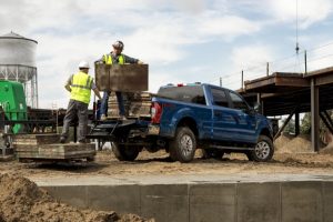 men using rear step of 2021 Ford Super Duty