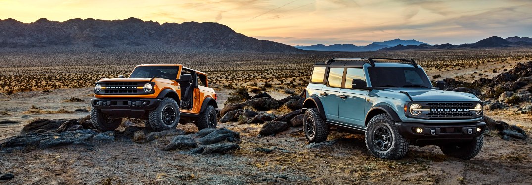two 2021 Ford Bronco SUVs in the desert