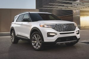front view of a white 2021 Ford Explorer Platinum Hybrid
