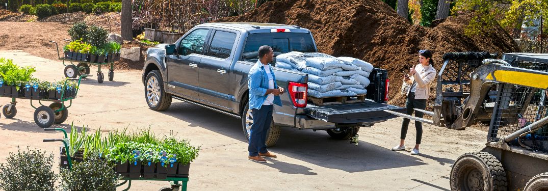 rear view of a silver 2021 Ford F-150 with a full cargo bed