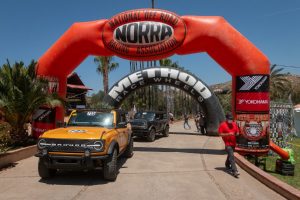 front view of a yellow 2021 Ford Bronco at NORRA starting line