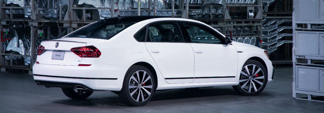 Passenger side exterior view of a white 2018 VW Passat