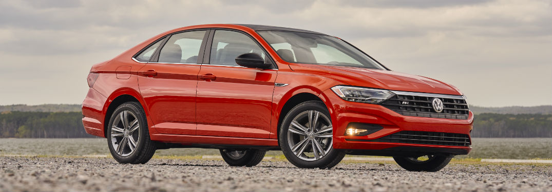 Passenger side exterior view of a red 2019 VW Jetta