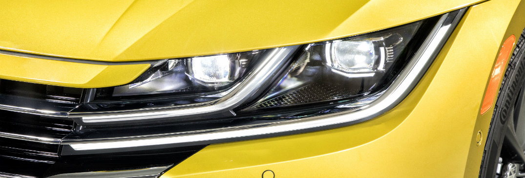 headlight of yellow volkswagen arteon