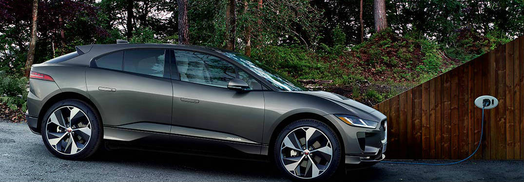 Gray 2019 Jaguar I-PACE EV Being Charged in a Driveway