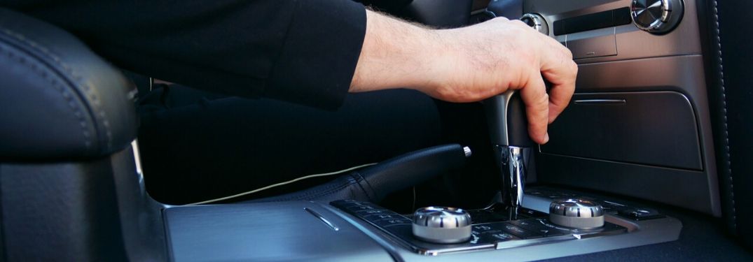 Hand Using Automatic Transmission in a Car