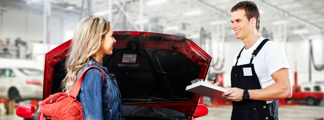 A mechanic talking to a woman